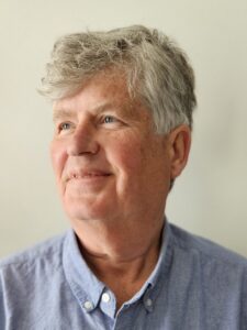 A headshot of The Migraine Trust trustee Iain Pelling